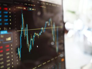 close-up of a financial chart on a computer screen, symbolizing the volatility and shifting trends in the real estate market, such as declining home prices and market corrections in areas like Cape Coral.