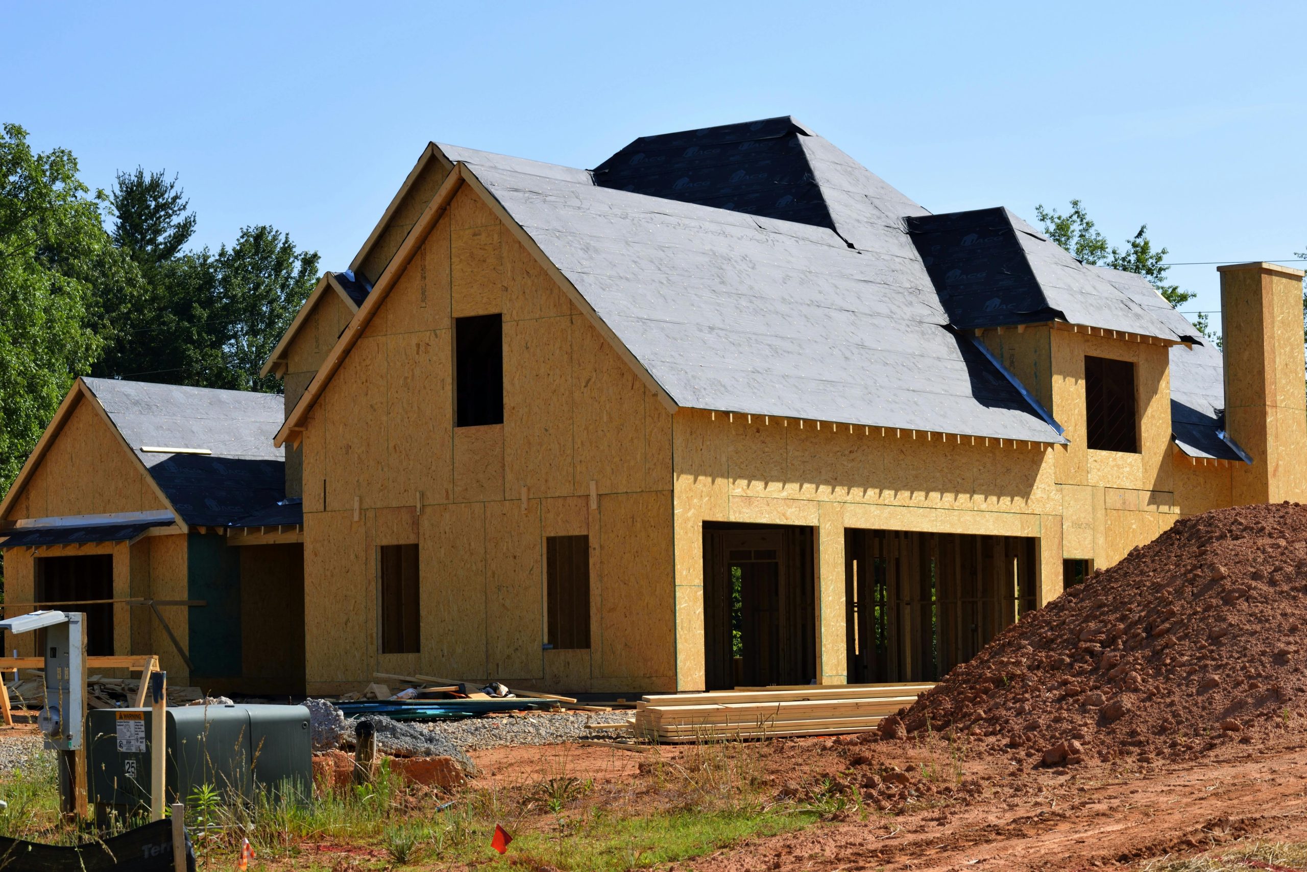 - Unbiased Real Estate Advice: The Truth About Real Estate Partially constructed home in a new housing development reflecting builder price cuts