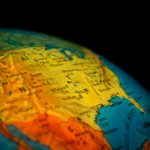 Close up photo of a globe showing the southern United States with cities like Dallas and Houston in focus, symbolizing Home Price Growth across U.S. markets.